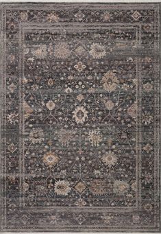 an area rug with many different colors and patterns on the carpet, including dark blue