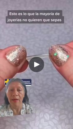 an older woman with gold and white glitters on her nails