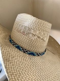 "1/2\" wide All bead work is beaded with 10lb extreme braided nylon line. All hat bands are finished at 23\" with glued than sewed down leather ends and an adjustable leather tie."