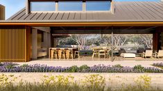 an artist's rendering of a modern house with outdoor dining and living areas in the foreground