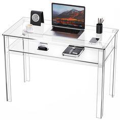 a clear desk with a laptop on it