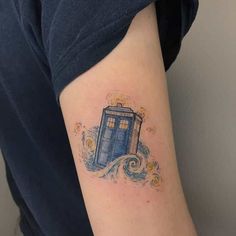 a doctor who is sitting on top of a blue tardish tattoo with waves coming out of it