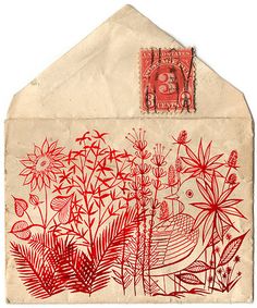 an envelope is decorated with orange flowers and plants on it's front, while a postage stamp has been placed in the background