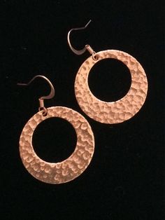 Lightweight Hammered copper hoop dangle earrings.Looking for something lightweight, bright and natural? This simple yet elegant pair of hammered copper earrings will definitely catch the light!These earrings are solid high-quality copper. One side is hammered, the other side of smooth. These earrings are 1 inch in diameter. They are very light weight, only 2 g. French ear wires are also solid copper.All my jewelry comes gift boxed with a custom Shelly Mariposa Design butterfly card ready for gif Hand Forged Copper Hoop Earrings With Dangle, Hand Forged Copper Dangle Hoop Earrings, Everyday Hammered Rose Gold Earrings, Everyday Rose Gold Hammered Earrings, Hammered Copper Round Hoop Earrings, Bronze Hammered Hoop Earrings, Hammered Copper Hoop Jewelry, Small Hoop Copper Jewelry, Small Copper Hoop Jewelry, Hammered