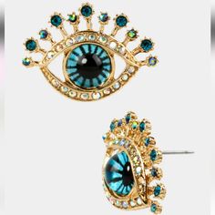 Betsey Johnson Blue Eyed Eye Catching Post Earrings. Every Girl Needs A Pair Of Eye-Catching Studs. These Blue-Eyed Earrings Are Perfect For The Office Or A Night Out. Crafted In Antique Gold-Tone Metal. Betsey Johnson 100% Authentic Gold-Tone Blue Eye Studs With Crystal Accents. Post Stud Style Earrings For Pierced Ears. Antique Gold Toned Metal Metal / Glass / Plastic 1” Long X 0.75” Wide New With Tags Evil Eye Jewellery, Art Jewelry Earrings, Embroidery Accessories, Betsey Johnson Clothes, Evil Eye Hamsa, Stud Style, Heart Drop Earrings, Hand Of Fatima, Eye Earrings