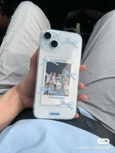 someone is holding up their cell phone case with an image on the front and back