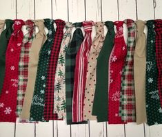 a row of christmas scarves hanging on a wall