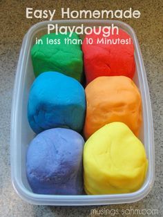 play dough in a plastic container with the title easy homemade playdouh in less than 10 minutes