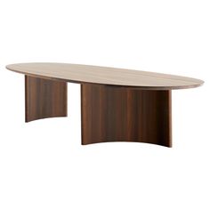 an oval wooden table with curved legs