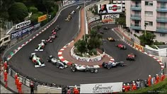 an aerial view of a race track with cars on it