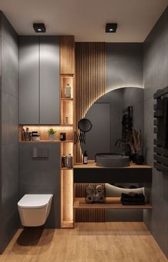 a modern bathroom with wood paneling on the walls and wooden flooring, along with a white toilet