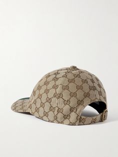 Gucci's canvas baseball cap is inspired by relaxed summers on the Italian coast. Covered with the iconic 'GG' monogram, it's trimmed with signature striped webbing at the brim and has an adjustable back tab for a secure fit. Luxury Adjustable Baseball Cap With Curved Visor, Designer Hats With Logo And Curved Brim, Luxury Baseball Cap With Embroidered Logo And Flat Brim, Casual Gucci Cap, Classic Gucci Hat With Flat Brim, Casual Gucci Hat With Curved Brim, Luxury Baseball Cap With Embroidered Logo And Visor, Luxury Baseball Cap With Logo And Curved Brim, Luxury Flat Brim Baseball Cap With Embroidered Logo