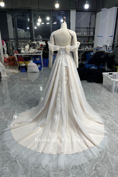 a wedding dress on display in a store