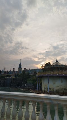 the sun is setting over an old building with scaffolding on it's roof