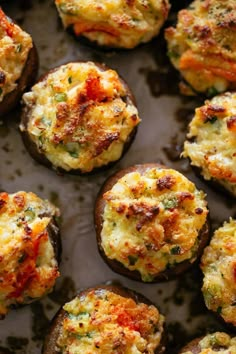 baked stuffed mushrooms with cheese and vegetables on a baking sheet, ready to be eaten