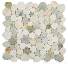 white and green pebbles are arranged in a square pattern