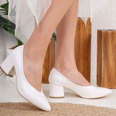 Welcome to Belle Wedding Shoes, your destination for exquisite White Bridal Block Heels that effortlessly blend style and comfort. * These low-block heels, boasting a 2-inch (5 cm) heel height, strike the perfect balance between grace and ease, making them ideal wedding shoes. * Crafted from premium white vegan leather, our White Bridal Stilettos offer both style and comfort. Meticulously handmade by skilled artisans, each pair reflects a dedication to craftsmanship and attention to detail. * Own your moment with these exceptional low-block heel stilettos that encapsulate luxury, style, and craftsmanship. Shop our collection of bridal sandals today and experience the Belle Wedding Shoes difference! Model: White Wedding Stilettos Heel Height: 2.1 inches / 5.5 cm Product Type: Handcrafted Co White Low Heel Shoes, White Low Block Heels Wedding, White Low Heels With Reinforced Heel, Bridal Stilettos, White Wedding Shoes With 4-inch Heel, Elegant White Wedding Shoes, Medium Width, White Heels, Medium Width, Low Heel, Shoes White Heels, Heels Low Heel