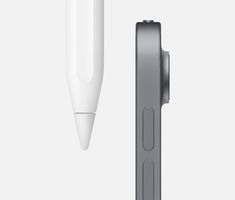 an electronic device with a pen attached to the back of it and another object in front of it