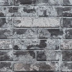 an old brick wall is shown in grey tones