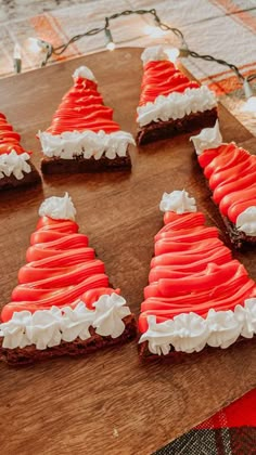 there are many pieces of food on the table together, and one is decorated like santa's hat