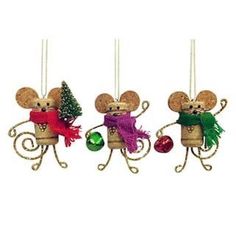 three ornaments in the shape of mice with christmas decorations hanging from their tails and arms