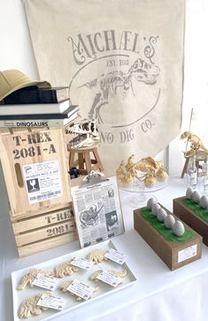 there are many items on the table to display in front of an official banner and other memorabilia