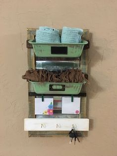 there is a shelf with several items on it that are hung up against the wall