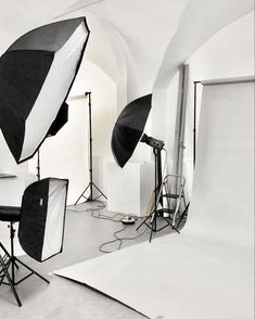 an empty studio with several lighting equipment