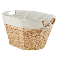 a large woven basket with white lining