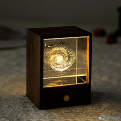 a small wooden box with a light inside