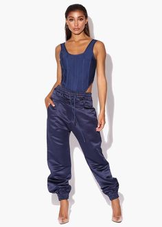 Stay stylish and chic in our twist on the classic wardrobe staple with the Tyra Navy Double Waisted Satin Trousers. The double waisted jean and elastic waistband is adjustable to suit every shape, it snatches the waist for a very flattering figure. Our super smooth and silky satin will keep you looking cool this season.Keep it sporty with a basic crop top and trainers or pair with heels for a chic day to night dinner look.  For a winter outfit pair with your favourite blazer jacket. Designed in Basic Crop Top, Feather Jacket, Satin Trousers, Classic Wardrobe Staples, Satin Pants, Orange Sweaters, Sweatshirt Zipper, Classic Wardrobe, Warm Coat