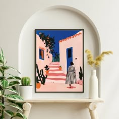 there is a painting on the wall next to a potted plant