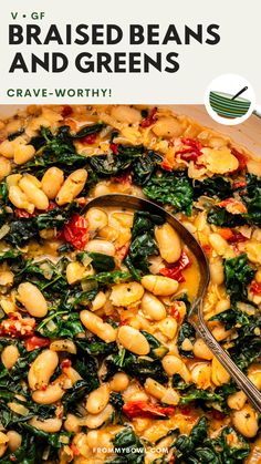 a pot filled with beans and greens next to a spoon