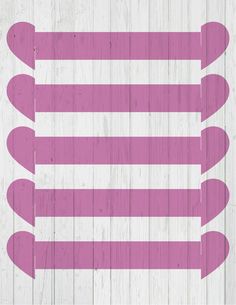 a pink and white striped pattern on wood