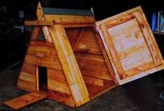 a wooden structure that has been made to look like a chicken coop