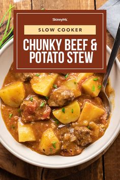 slow cooker chunk beef and potato stew in a white bowl on a wooden table