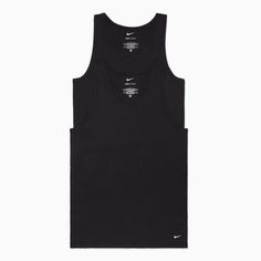 These men's Nike tank undershirts make the perfect layering piece. 2-pack Nike Dri-FIT technology absorbs sweat quickly to keep you cool & dry Crewneck SleevelessFABRIC & CARE Cotton, spandex Machine wash Imported Size: XL. Color: Black. Gender: male. Age Group: adult. Pattern: Solid. Classic Black Tank Top, Nike Cotton Workout Tops, Nike Cotton Tank Top For Workout, Nike Classic Fitted Tops, Classic Fitted Nike Tops, Sleeveless Cotton Nike Top, Classic Black Cotton Tank Top, Black Cotton Tank Top For Layering, Nike Tank