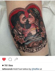 a man and woman are in a heart shaped tattoo