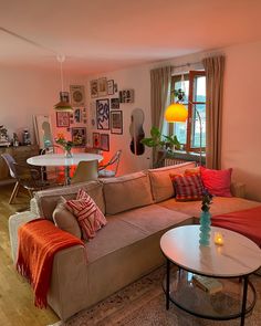 a living room filled with furniture and decor