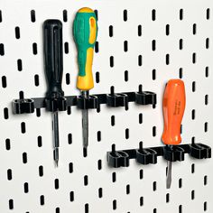 there is a peg board with some tools on it