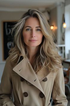 A woman with a long layered cut for thick hair, giving volume and movement Next Fashion, Style Upgrade