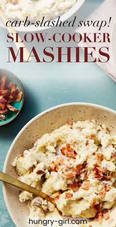 a bowl filled with mashed potatoes on top of a blue table