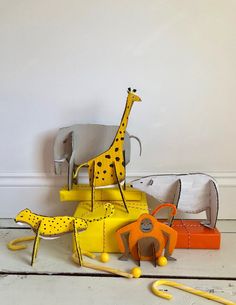 two giraffes are standing next to each other in front of a chair