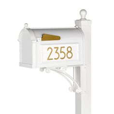 a white mailbox with the number 2238 on it's front and side