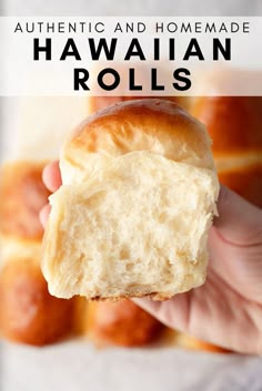 a person holding a piece of bread in their hand with the text authentic and homemade hawaiian rolls