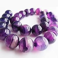 two bracelets with purple and white marble beads