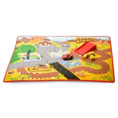 a children's play mat with cars and trucks on the road in front of it