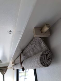 a roll of fabric hanging on the side of a wall