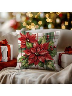 a christmas pillow with poinsettis on it