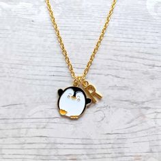 a necklace with a penguin on it